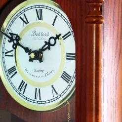 Bedford Clocks Collection 25 Inch Wall Clock With Pendulum And Chime In Dark Redwood Oak Finish
